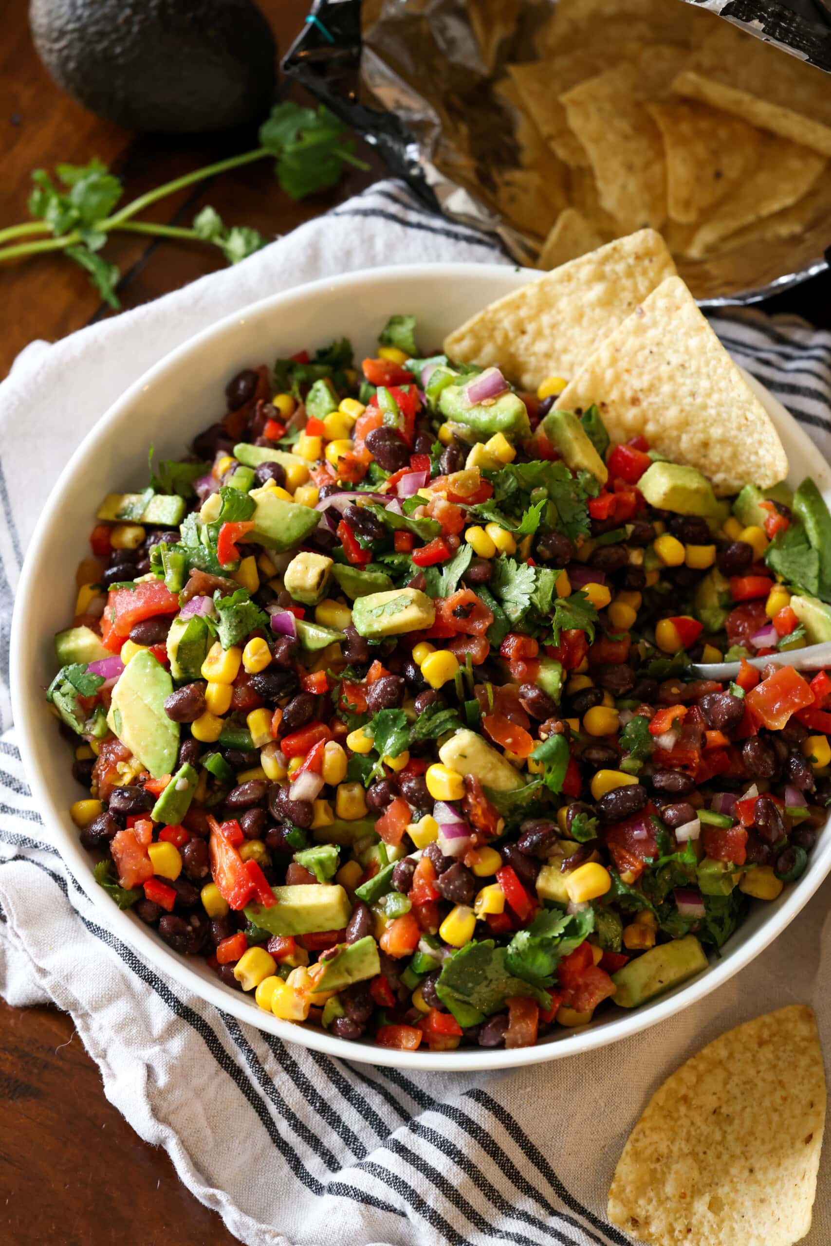 This easy Cowboy Caviar Recipe is the perfect appetizer or even light dinner. Enjoy it with a bowl chips, as a baked potato topper, or on top of a plate of nachos! A bowl of Cowboy Caviar